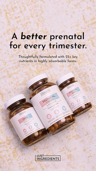 A clean, studio-lit display of three prenatal supplement bottles with bold benefit-focused text on a neutral, textured background.
